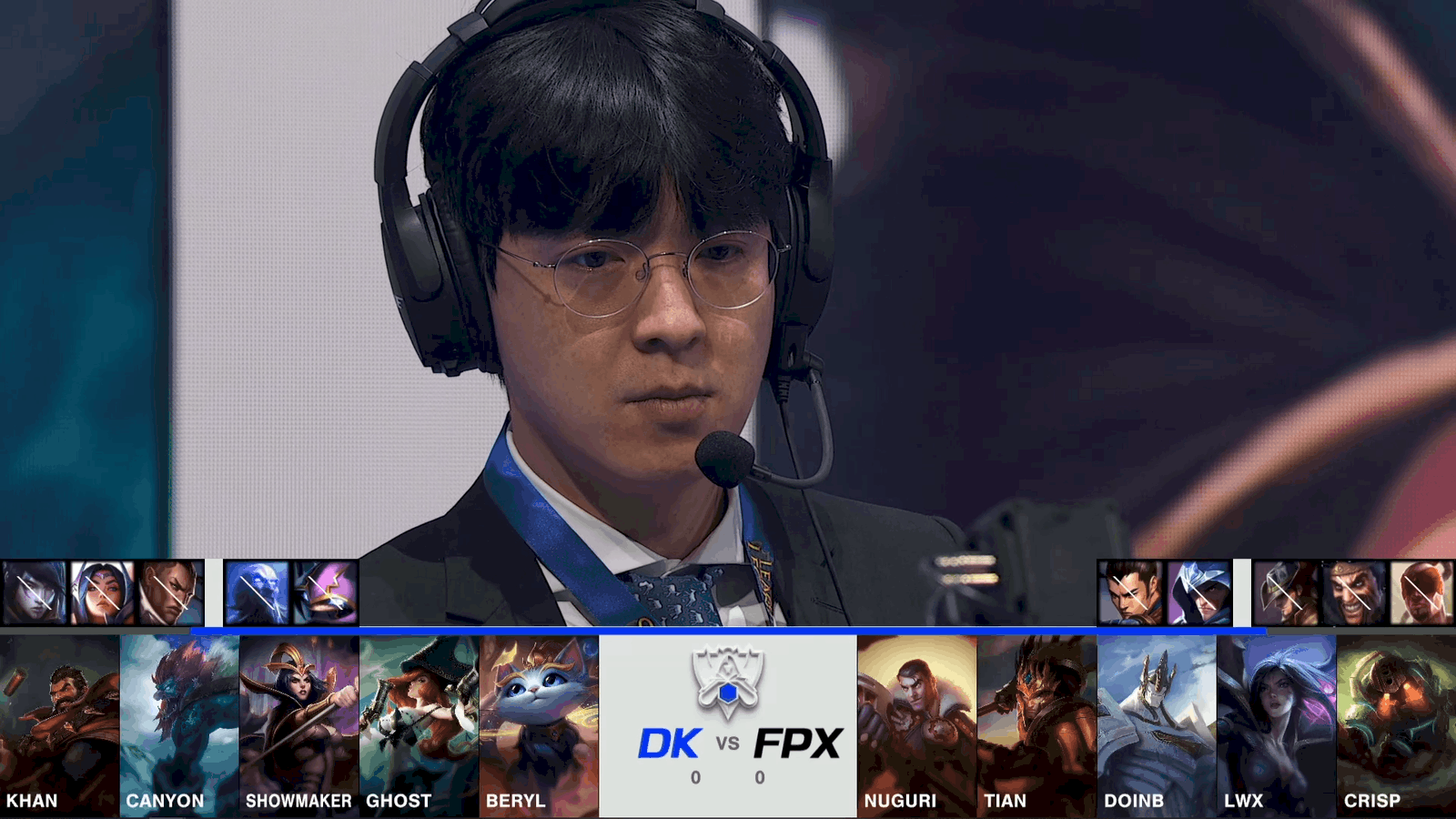 A screenshot from the 2021 World Championship Main Event Group Stage broadcast, showing the champion drafts between DAMWON KIA and FunPlus Phoenix with a shot of coach kkOma above.