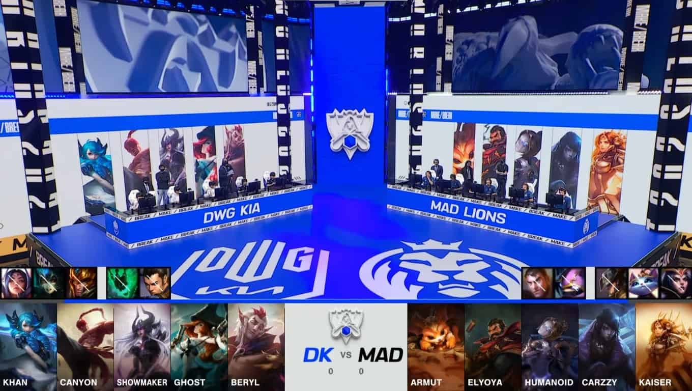 A screenshot from the 2021 World Championship Main Event Quarterfinals broadcast, showing the Game One champion drafts between DAMWON KIA and MAD Lions with a shot of the teams on stage above.