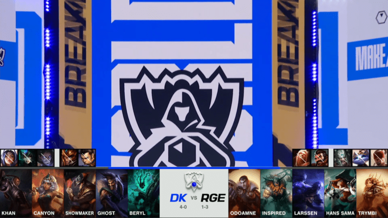 A screenshot from the 2021 World Championship Main Event Group Stage broadcast, showing the champion drafts between DAMWON KIA and Rogue with a shot of the LoL Esports logo and part of the Worlds 2021 stage above.