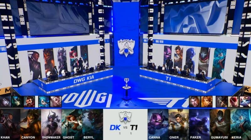 A screenshot from the 2021 World Championship Main Event Semifinals broadcast, showing the Game Three champion drafts between DAMWON KIA and T1 with a shot of the teams on the Worlds 2021 stage above.