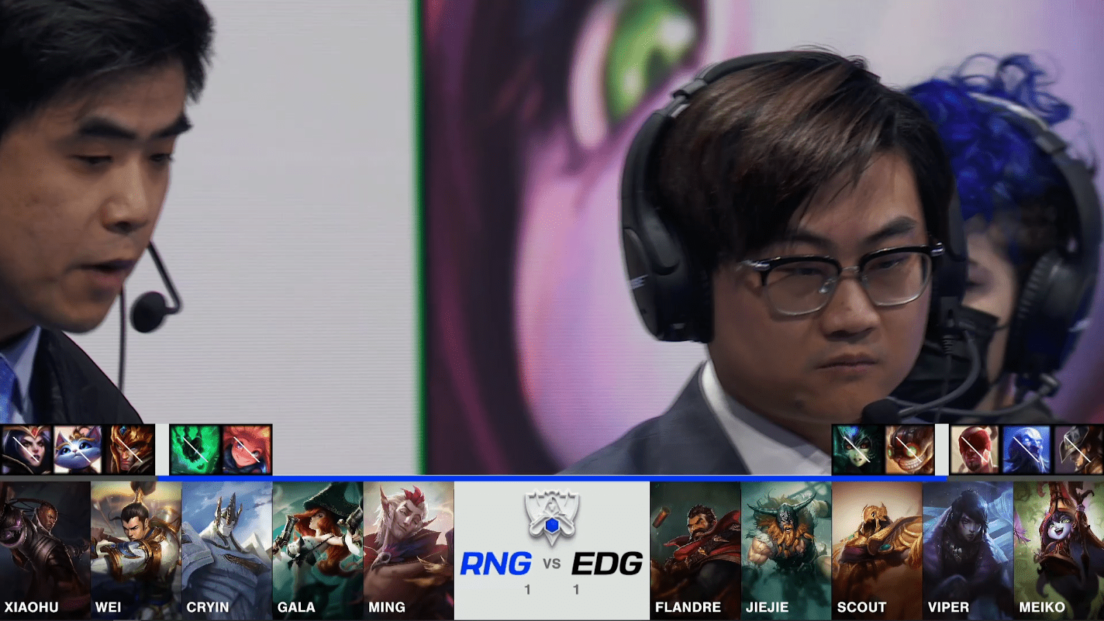 A screenshot from the 2021 World Championship Main Event Quarterfinals broadcast, showing the Game Three champion drafts between Royal Never Give Up and Edward Gaming with a shot of two coaches above.