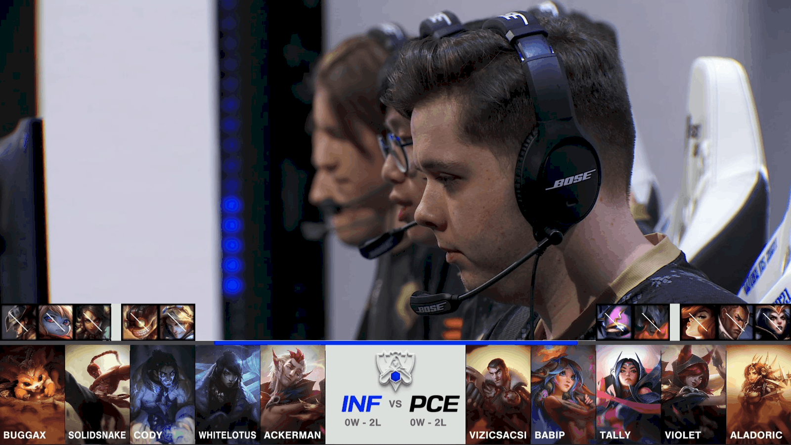A screenshot from the 2021 World Championship Play-ins broadcast, showing the drafts between Infinity Esports and PEACE with a shot of the PEACE roster on stage in the middle.