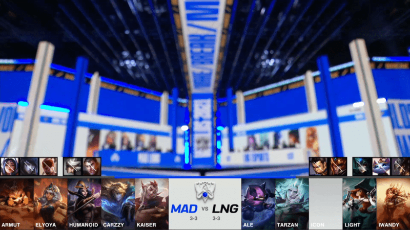 A screenshot from the 2021 World Championship Main Event Group Stage broadcast, showing the champion drafts for the tiebreaker between MAD Lions and LNG Esports with a blurry shot of the Worlds 2021 stage above.