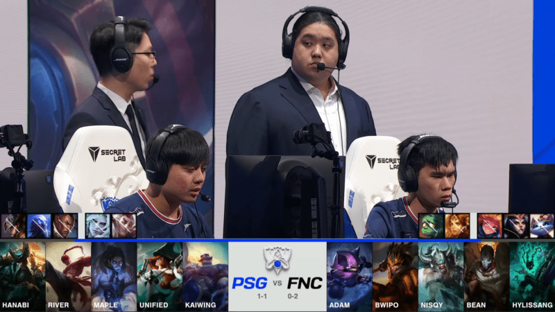 A screenshot from the 2021 World Championship Main Event Group Stage broadcast, showing the champion drafts between PSG.Talon and Fnatic with a shot of PSG players and coaches on stage above.
