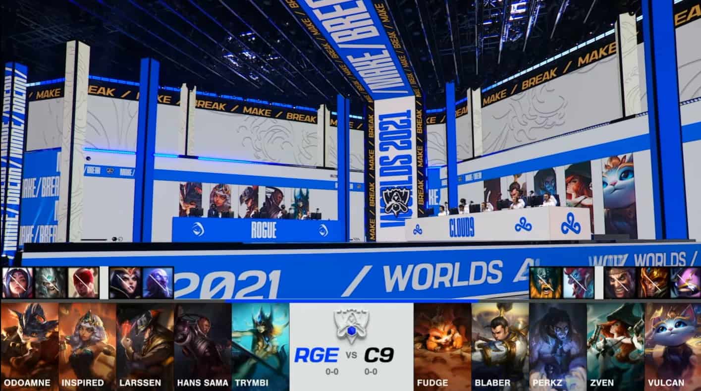 A screenshot from the 2021 World Championship Main Event Group Stage broadcast, showing the champion drafts between Rogue and Cloud9 with a shot of Rogue and C9 on the Worlds 2021 stage above.