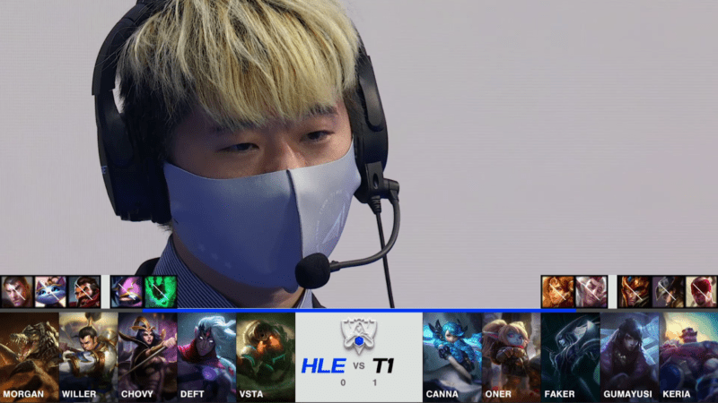 A screenshot from the 2021 World Championship Main Event Quarterfinals broadcast, showing the Game Two champion drafts between Hanwha Life and T1 with a shot of a team coach above.