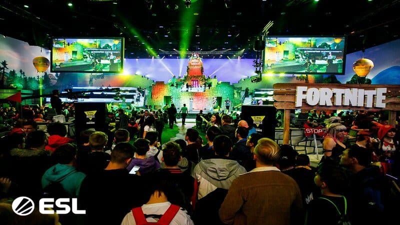 Fans gather around to watch pros compete at a LAN event