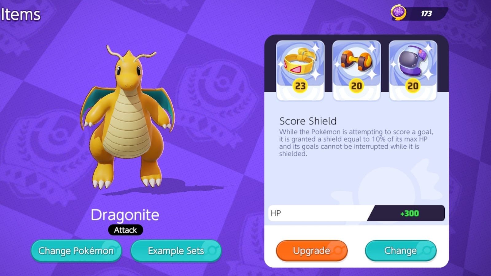 The loadout screen for Dragonite showing the items Score Shield and Attack Weight equipped