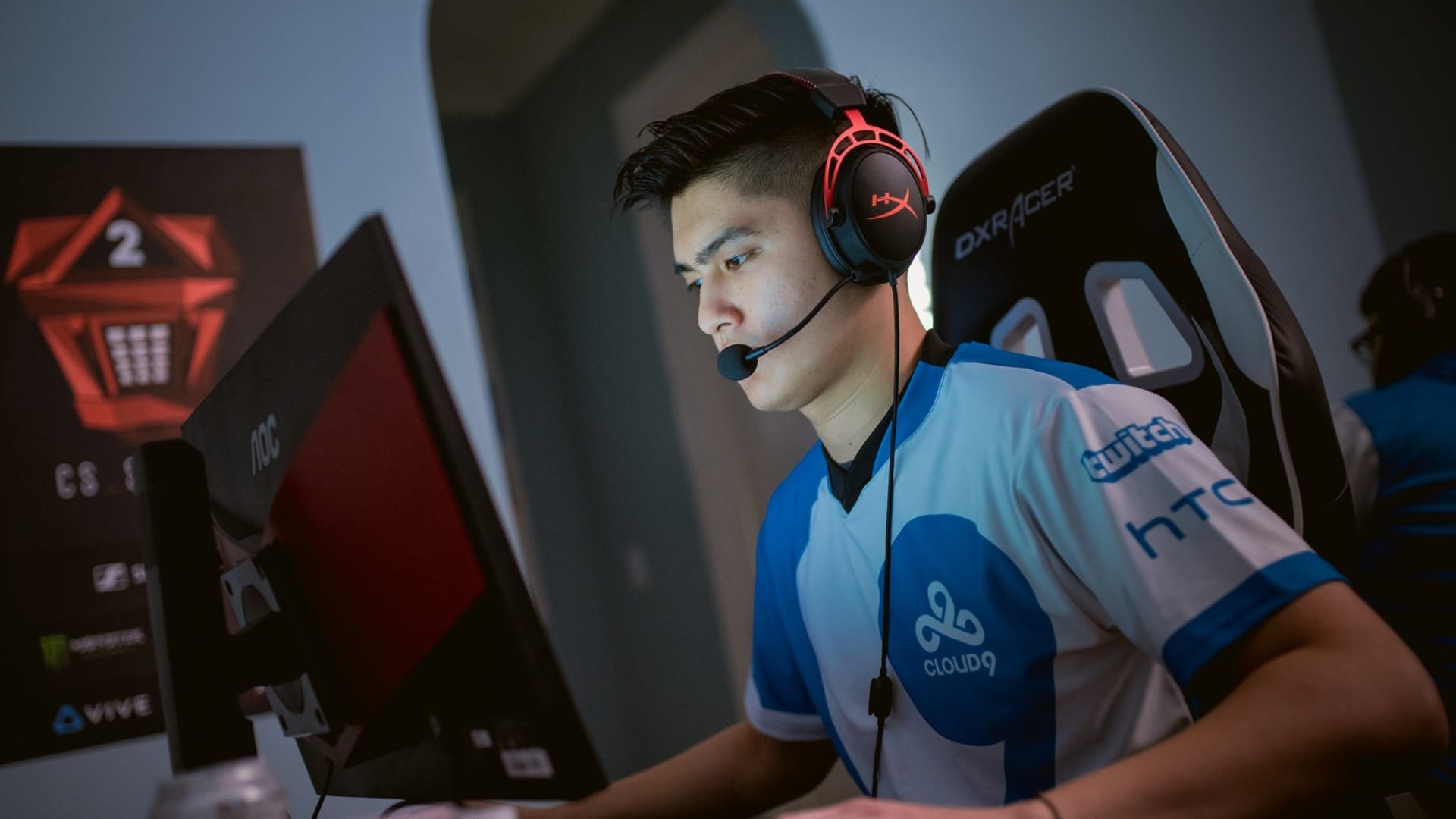 Timothy "autimatic" Ta sits at his PC in his Cloud9 Jersey during a game of CS:GO
