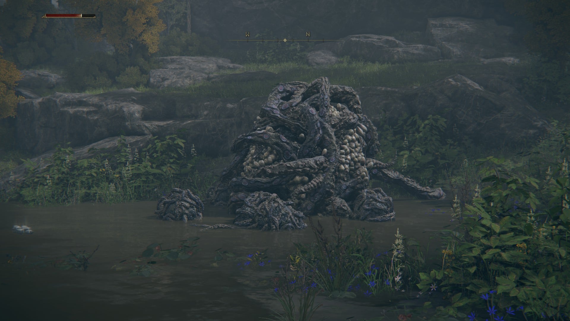 A writhing mass of wood and tentacles, one of the unique beasts in Elden Ring