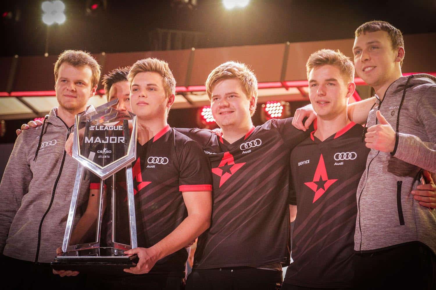 Astralis device dupreeh xyp9x gla1ve on stage 2017 eleague major with kjaerbye holding trophy on stage 